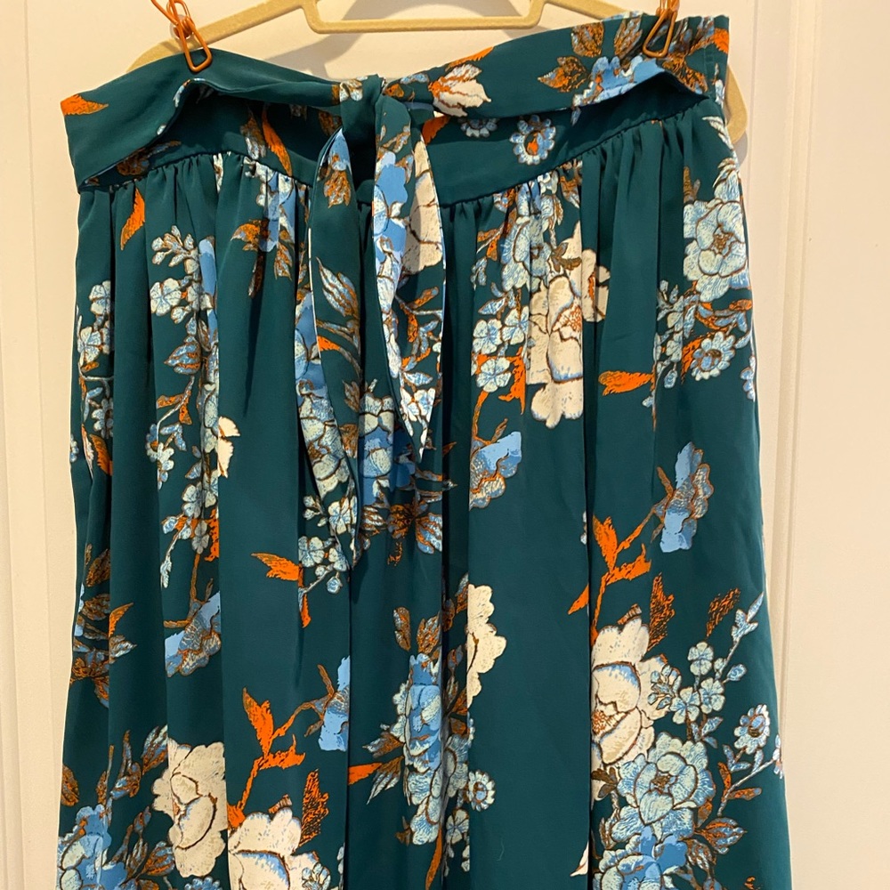 Midi-length circle skirt with self tie belt